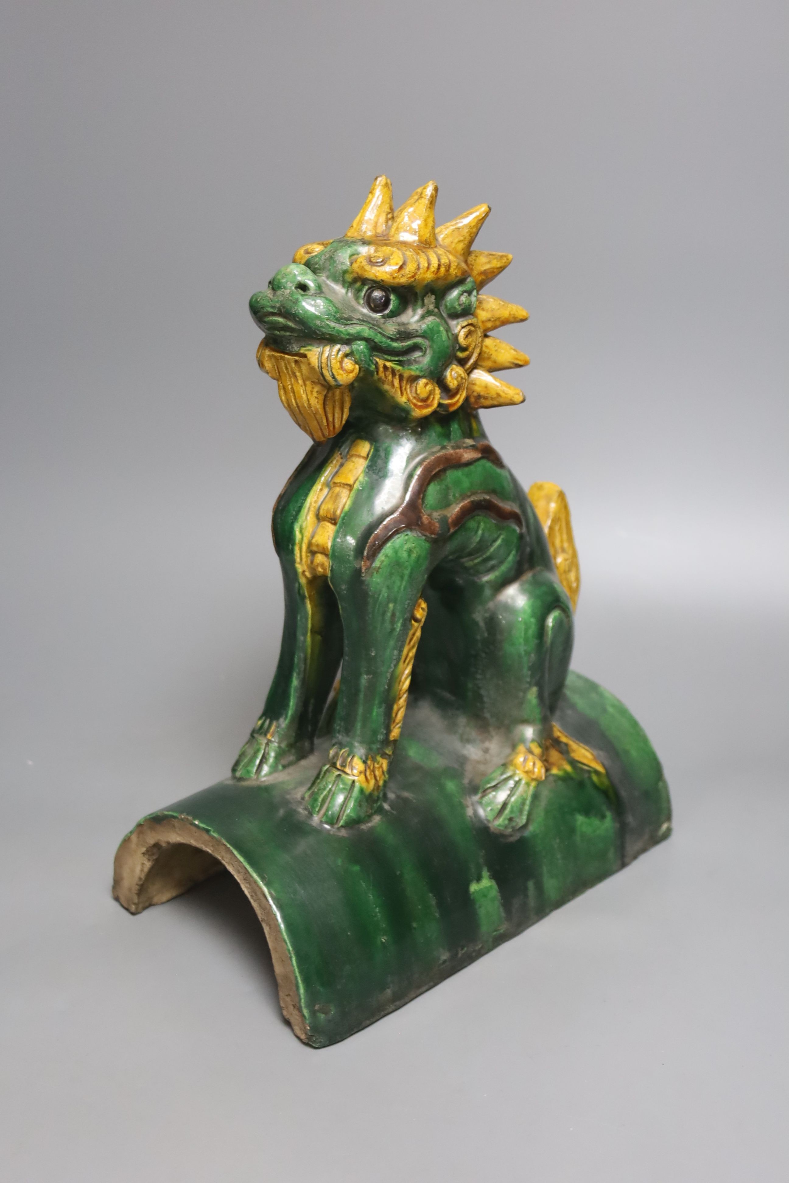A Chinese pottery ‘lion dog’ ridge tile 33cm